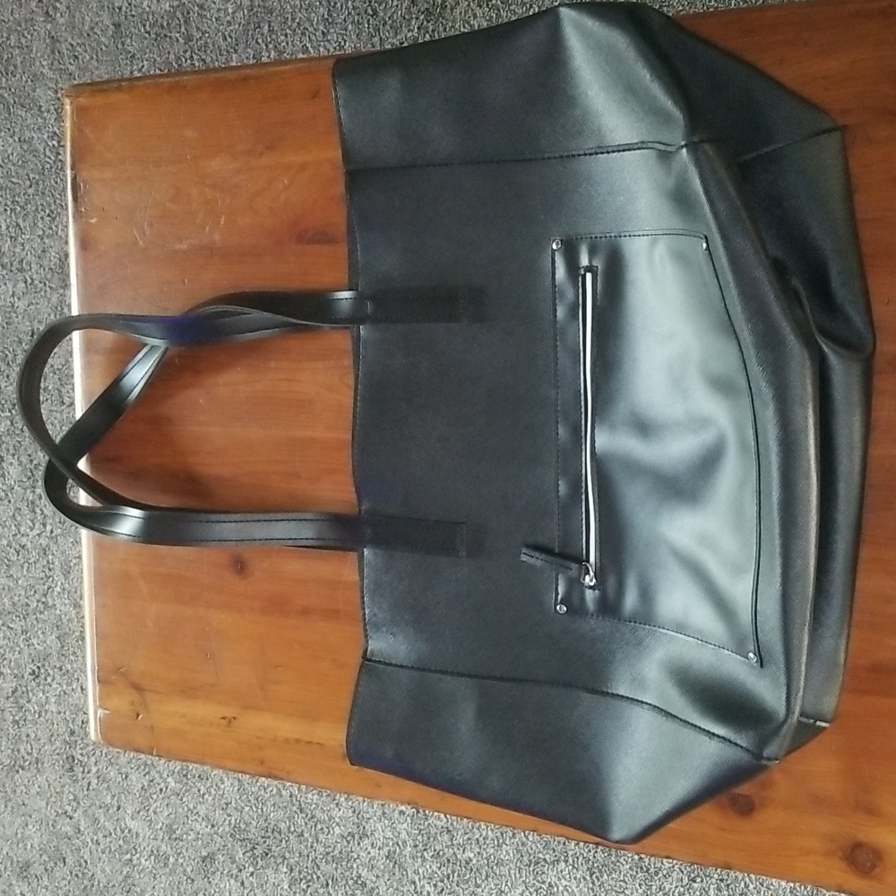 Black vinyl tote bag.